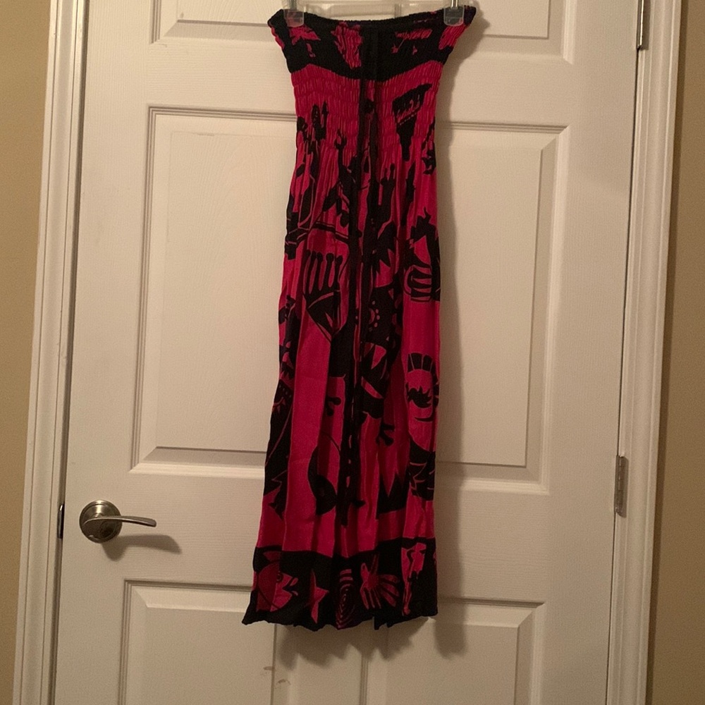 Sleeveless animal and symbol design dress.